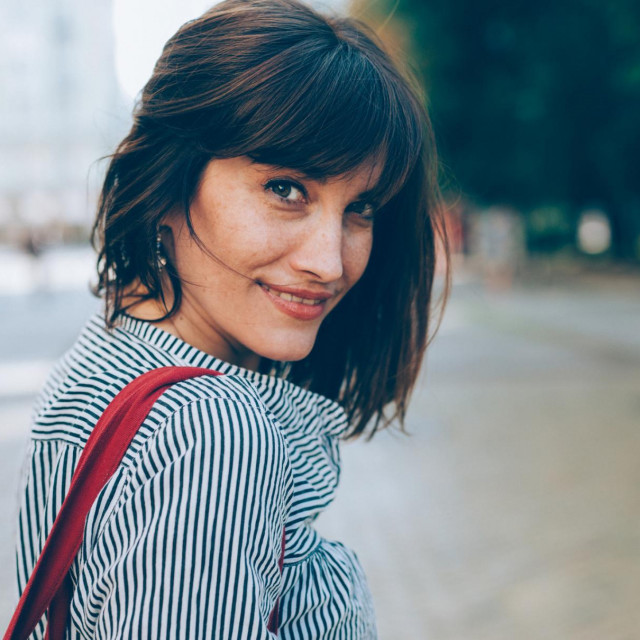 Portrait of a beautiful middle-aged woman outdoors.