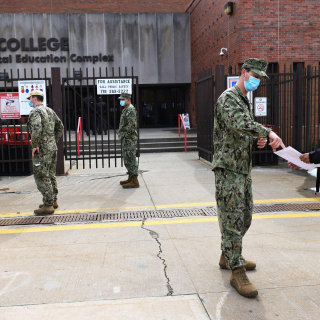 NEW YORK, NEW YORK - FEBRUARY 24: National Guard soldiers help people at the York College coronavirus (COVID-19) vaccination site on February 24, 2021 in the Jamaica neighborhood of Queens borough in New York City. On February 19, Gov. Andrew Cuomo announced the opening of two State-FEMA community-based sites for the coronavirus (COVID-19) vaccine in Brooklyn and Queens and encouraged eligible individuals to get vaccinated. The sites, which will operate between 8 a.m. and 8 p.m. daily, have the capacity to administer 3,000 doses per day. Michael M. Santiago/Getty Images/AFP
== FOR NEWSPAPERS, INTERNET, TELCOS & TELEVISION USE ONLY ==