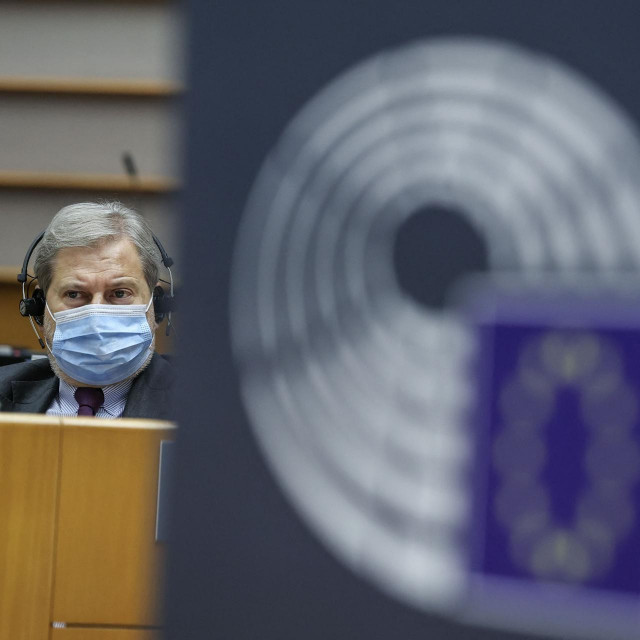 EU Commissioner for Budget Johannes Hahn looks on during the debate on the application of Regulation (EC) 2020/2092, the Rule of Law conditionality mechanism during a plenary session of The European Parliament in Brussels on March 11, 2021. (Photo by Aris Oikonomou/POOL/AFP)
