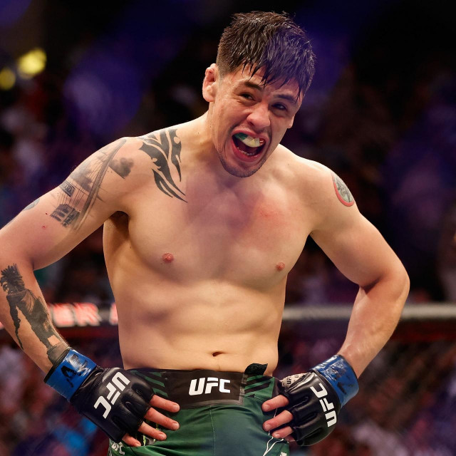 GLENDALE, ARIZONA - JUNE 12: Brandon Moreno of Mexico celebrates after defeating Deiveson Figueiredo of Brazil to win the flyweight championship during their UFC 263 match at Gila River Arena on June 12, 2021 in Glendale, Arizona.
== FOR NEWSPAPERS, INTERNET, TELCOS & TELEVISION USE ONLY ==