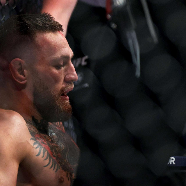 LAS VEGAS, NEVADA - JULY 10: Conor McGregor of Ireland sits on the mat after injuring his ankle in the first round in his lightweight bout against Dustin Poirier during UFC 264: Poirier v McGregor 3 at T-Mobile Arena on July 10, 2021 in Las Vegas, Nevada. Stacy Revere/Getty Images/AFP
== FOR NEWSPAPERS, INTERNET, TELCOS & TELEVISION USE ONLY ==