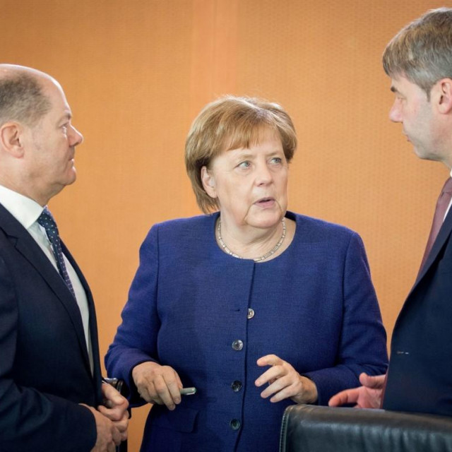 Angela Merkel i Jan Hecker (desno na fotografiji)