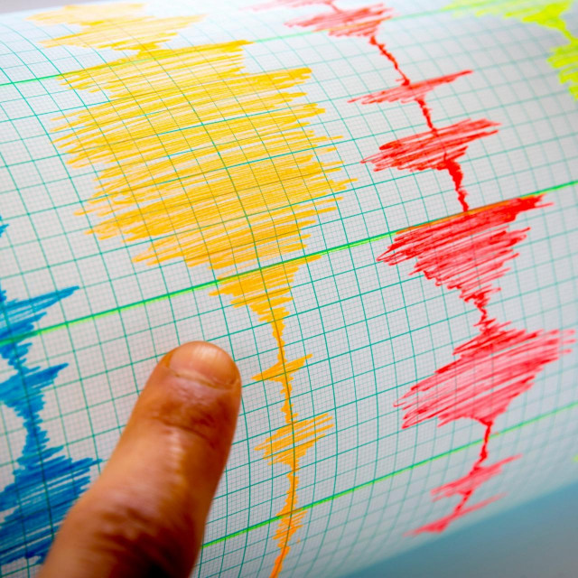 Seismological device for measuring earthquakes. Seismological activity lines on the sheet of measuring paper. Earthquake wave on graph paper. Vignette image. Human finger showing a detail.,Image: 299915020, License: Royalty-free, Restrictions:, Model Release: no, Credit line: Pluto/Alamy/Alamy/Profimedia