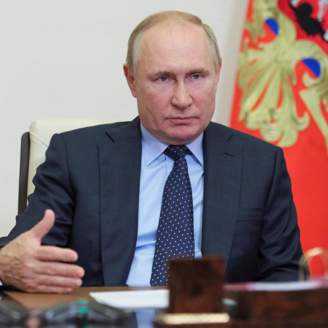 Russian President Vladimir Putin speaks with Russia's local authorities during a video link meeting at the Novo-Ogaryovo state residence outside Moscow on October 4, 2021. (Photo by Evgeny Paulin/SPUTNIK/AFP)
