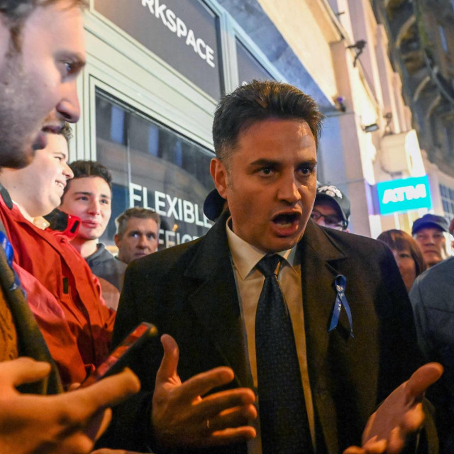Opposition leader, mayor of Hodmezovasarhely, Peter Marki-Zay talks with local citizens after winning the two-round opposition primary in Budapest on October 17, 2021. - Marki-Zay won the two-round opposition primary in Hungary and he is set to challenge Prime Minister Viktor Orban in next year‘s election. The opposition agreed for the first time to choose just one contender to oppose Orban -- as well as single candidates in each constituency to go up against the Fidesz party -- in the vote expected in April next year. (Photo by ATTILA KISBENEDEK/AFP)
