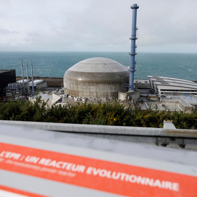 (FILES) This file photo taken on November 16, 2016, shows the construction site of the European Pressurised Reactor project (EPR). - Electricity network RTE published on October 25, 2021, its main conclusions on the future of the French network in 2050, estimating that it would be ”relevant” economically to build new nuclear reactors, while insisting on the need to develop renewable energies. (Photo by CHARLY TRIBALLEAU/AFP)
