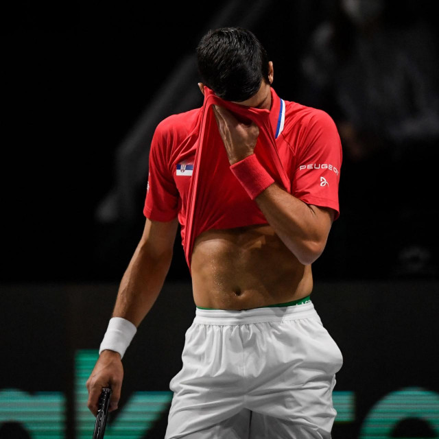 Serbia's Novak Djokovic reacts during the men's singles quarter-final tennis match between Serbia and Kazakhstan of the Davis Cup tennis tournament at the Madrid arena in Madrid on December 1, 2021. (Photo by OSCAR DEL POZO/AFP)
