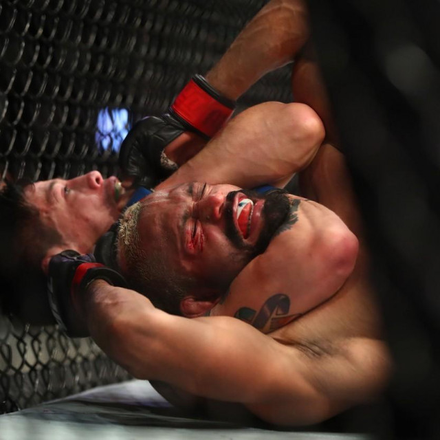 Jun 12, 2021; Glendale, Arizona, USA; Brandon Moreno applies a choke hold for the victory against Deiveson Figueiredo during UFC 263 at Gila River Arena.,Image: 615454363, License: Rights-managed, Restrictions: *** World Rights ***, Model Release: no, Credit line: USA TODAY Network/ddp USA/Profimedia