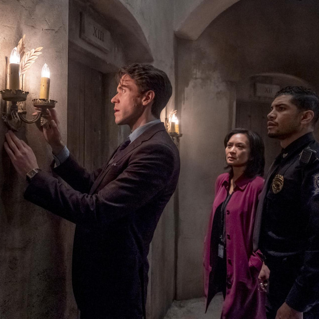 DAN BROWN'S THE LOST SYMBOL -- ”Pilot” Episode 101 -- Pictured: (l-r) Ashley Zukerman as Robert Langdon, Sumalee Montano as Agent Sato, Rick Gonzalez as Nunez -- (Photo by: Rafy/Peacock)
