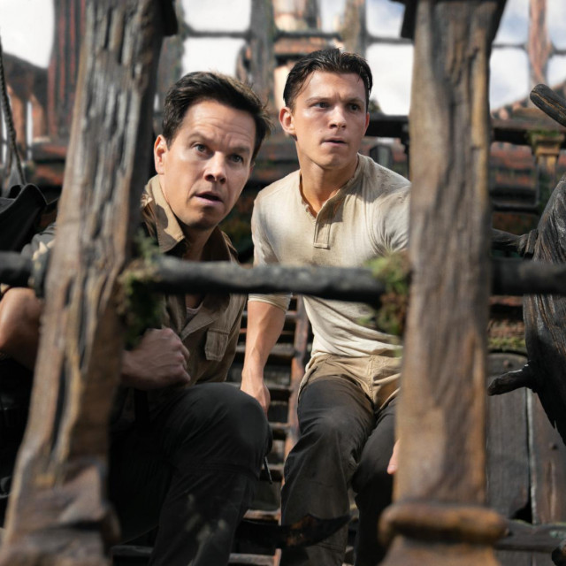 Victor ”Sully” Sullivan (Mark Wahlberg) and Nathan Drake (Tom Holland) look to make their move in Columbia Pictures' UNCHARTED. photo by: Clay Enos
