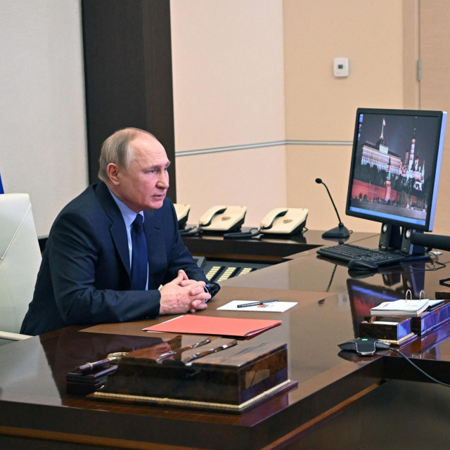 Russian President Vladimir Putin chairs a meeting with members of the Security Council via teleconference call, at the Novo-Ogaryovo state residence, outside Moscow, Russia, on February 11, 2022. (Photo by Alexey NIKOLSKY/Sputnik/AFP)
