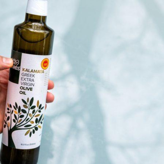 A bottle of olive oil sold in the US bearing the distinctive EU's quality scheme label of protected designation of origins (PDO).
