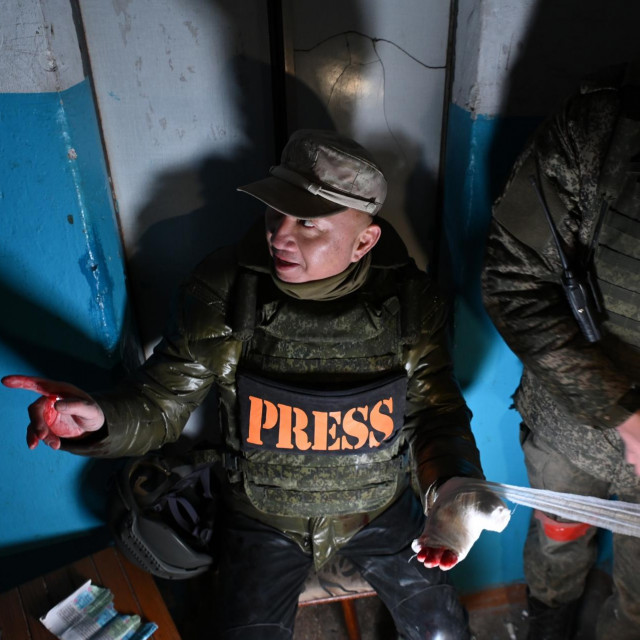  Ozlijeđeni kineski reporter Liu Yu Guang 
