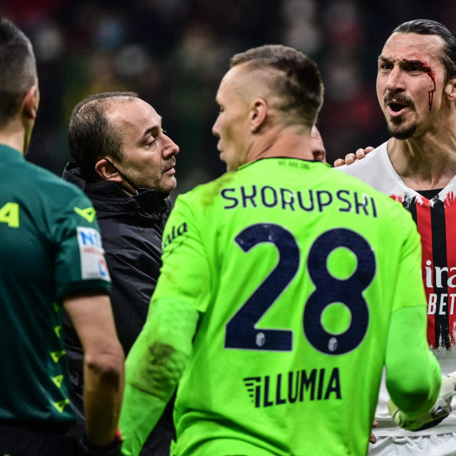 AC Milan's Swedish forward Zlatan Ibrahimovic reacts after being injured following a collision during the Italian Serie A football match between AC Milan and Bologna on April 4, 2022 at the San Siro stadium in Milan. (Photo by MIGUEL MEDINA/AFP)