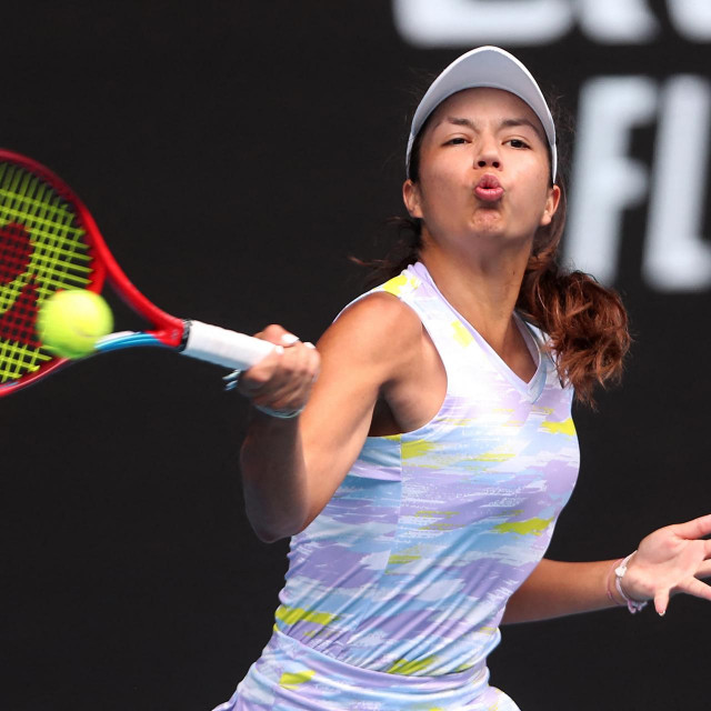 Petra Marcinko of Croatia hits a return against Sofia Costoulas of Belgium during their junior girls final match on day thirteen of the Australian Open tennis tournament in Melbourne on January 29, 2022. (Photo by BRANDON MALONE/AFP)/-- IMAGE RESTRICTED TO EDITORIAL USE - STRICTLY NO COMMERCIAL USE --
