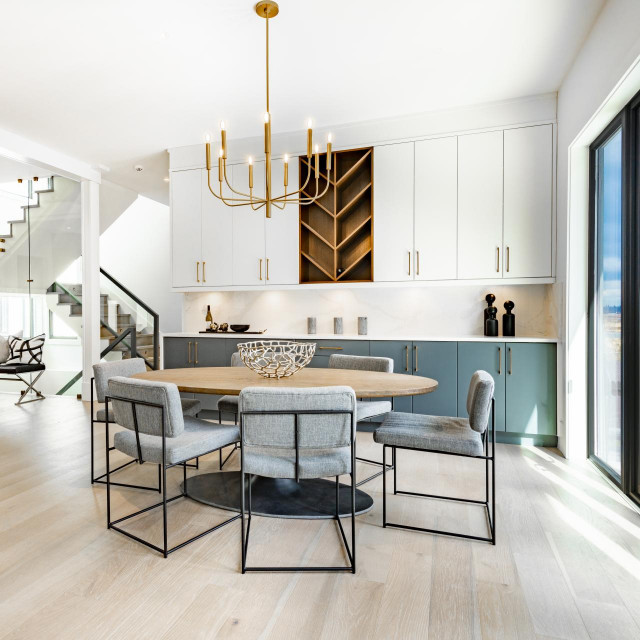 contemporary living room with open concept view through to dining room kitchen and a marble fireplace with gas fire