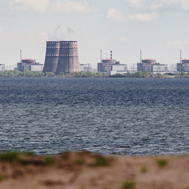 (FILES) In this file photo taken on April 27, 2022 shows a general view of the Zaporizhzhia nuclear power plant, situated in the Russian-controlled area of Enerhodar, seen from Nikopol. Russian occupation authorities at Ukraine‘s Zaporizhzhia nuclear power plant said on August 7, 2022, a strike by Ukrainian forces damaged administrative buildings inside the complex. Zaporizhzhia -- Europe‘s largest atomic power complex that was occupied by Russia early in its offensive -- has in recent days been the scene of military strikes that have damaged several structures, forcing the shutdown of a reactor.,Image: 712556003, License: Rights-managed, Restrictions:, Model Release: no, Credit line: Ed JONES/AFP/Profimedia
