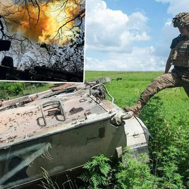 Ukrajinski vojnik pored napuštenog ruskog tenka