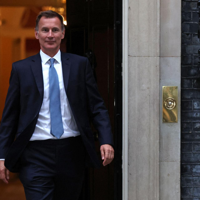 Britain‘s new Chancellor of the Exchequer Jeremy Hunt leaves 10 Downing Street in central London on October 14, 2022, after having a meeting with Britain‘s Prime Minister Liz Truss. - Newly appointed UK finance minister Jeremy Hunt is a mild-mannered political survivor who will require all of his considerable experience to calm an economy and government beset by chaos. (Photo by ISABEL INFANTES/AFP)