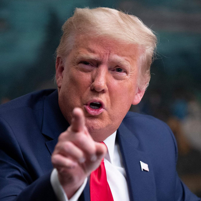 (FILES) In this file photo taken on November 26, 2020 US President Donald Trump speaks to reporters after participating in a Thanksgiving teleconference with members of the United States Military, at the White House in Washington, DC. - Lawmakers probing the 2021 attack on the US Capitol voted on October 13, 2022 to subpoena former president Donald Trump to testify on his role in the violence, in a major escalation of the sprawling inquiry weeks before it is due to wind up. (Photo by Andrew CABALLERO-REYNOLDS/AFP)