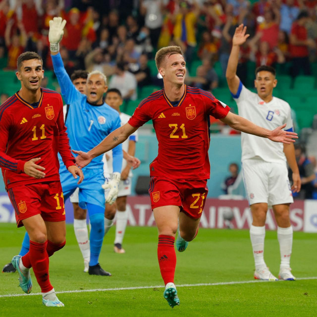Spain‘s forward #21 Dani Olmo reacts after scoring the opening goal during the Qatar 2022 World Cup Group E football match between Spain and Costa Rica at the Al-Thumama Stadium in Doha on November 23, 2022. (Photo by Odd ANDERSEN/AFP)