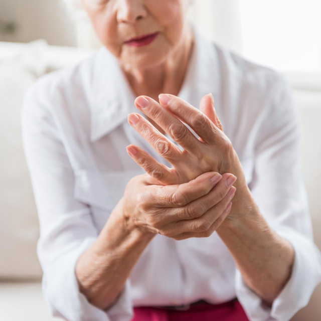 Elderly female is expressing pain