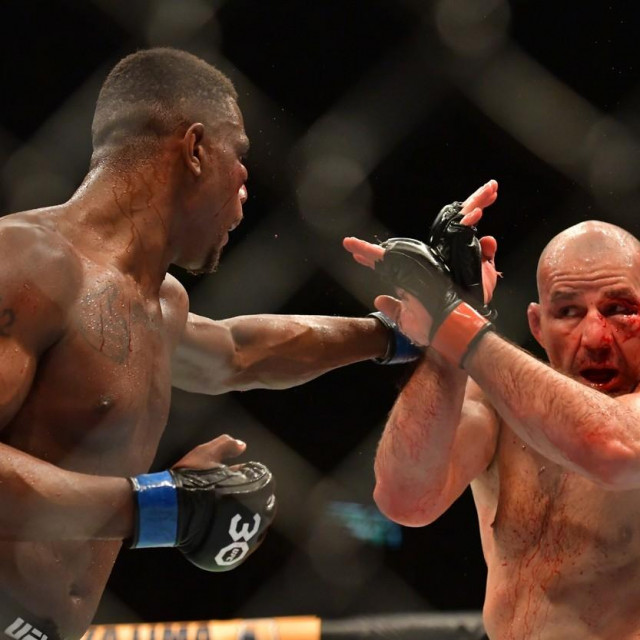  Jamahal Hill punches Glover Teixeira 