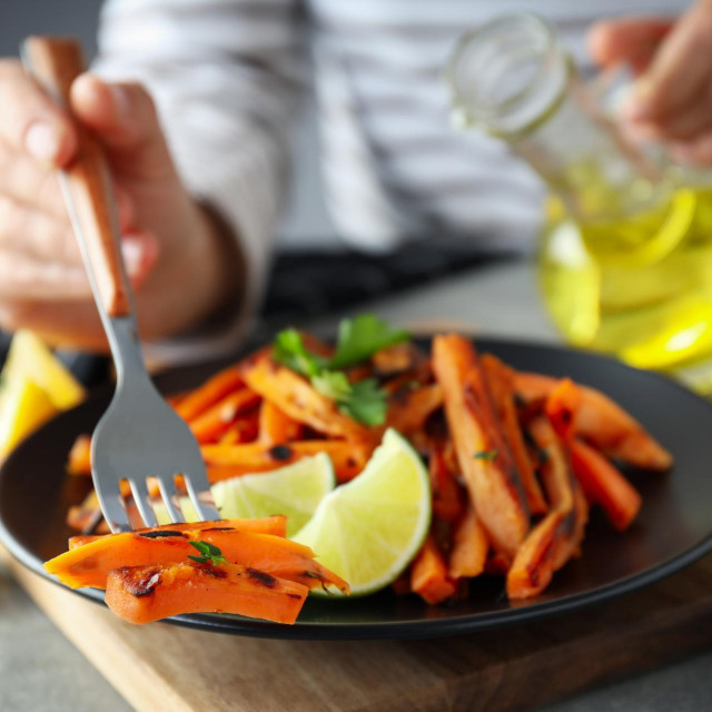 Concept of tasty food, fried sweet potato, close up