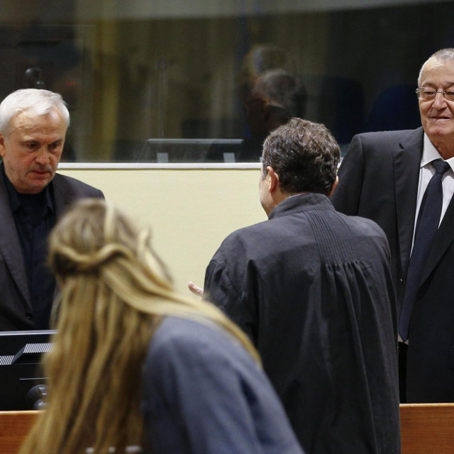 EDITORS NOTE: Graphic content/(FILES) Former Serbian intelligence chiefs, Jovica Stanisic (L) and Franko Simatovic (R) appear in court as they go back on trial before a UN court in The Hague on June 13, 2017 at the United Nations Mechanism for International Criminal Tribunal, accused of running death squads that terrorised Bosnia and Croatia in the bloody 1990s Balkans wars. A UN court upheld the convictions of two spy chiefs under late Serbian president Slobodan Milosevic and lengthened their sentences from 12 to 15 years on May 31, 2023.
”The appeals chamber dismisses the appeals by (Jovica) Stanisic and (Franko) Simatovic... and imposes a sentence of 15 years” on each, head appeals judge Graciela Gatti Santana said. (Photo by Michael Kooren/ANP/AFP)