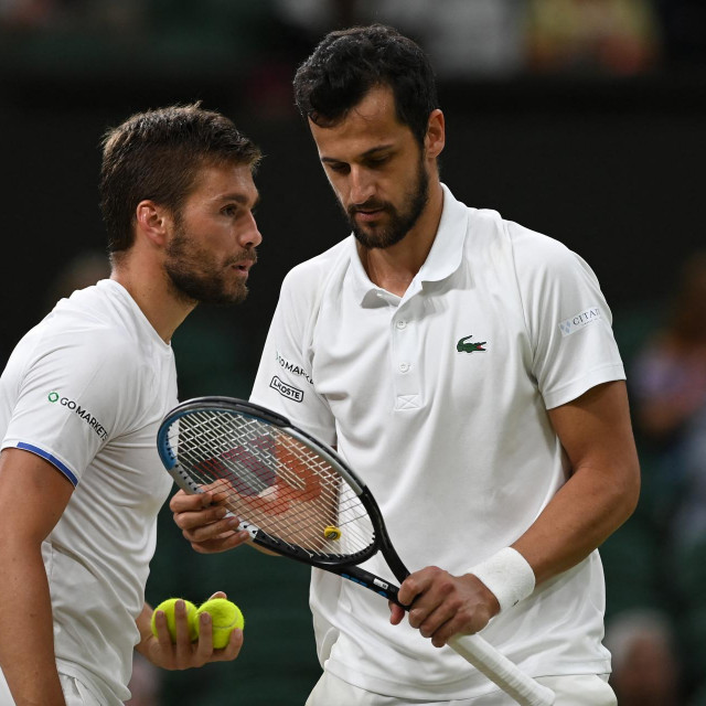Nikola Mektić i Mate Pavić tijekom Wimbledona 2021. kada su ga i osvojili