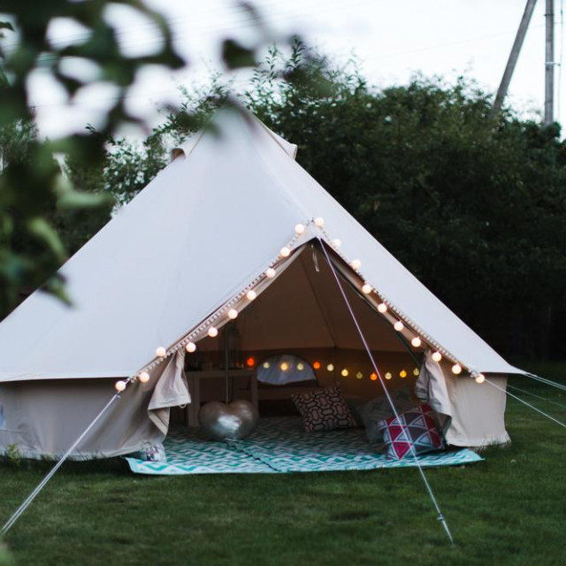 Canvas cotton Bell tent in the yard decorated for summer kids party