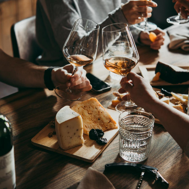 Wine and cheese served for a friendly party in a bar or a restaurant.