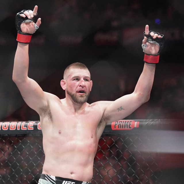 Apr 15, 2023; Kansas City, Missouri, USA; Dustin Jacoby (red gloves) reacts after the fight Azamat Murzakanov (blue gloves) during UFC Fight Night at T-Mobile Center.,Image: 769746703, License: Rights-managed, Restrictions: *** World Rights ***, Model Release: no, Credit line: USA TODAY Network/ddp USA/Profimedia