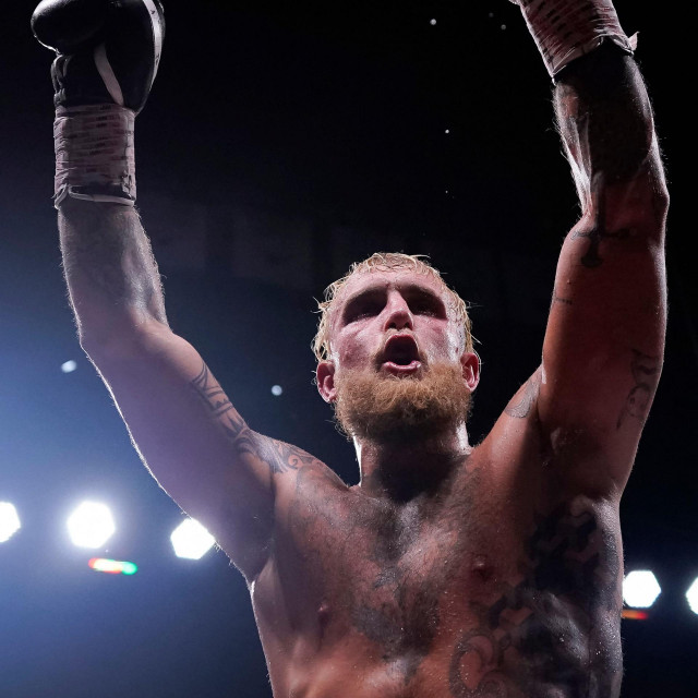 DALLAS, TEXAS - AUGUST 05: Jake Paul raises his arms in the air after his fight against Nate Diaz at American Airlines Center on August 05, 2023 in Dallas, Texas. Sam Hodde/Getty Images/AFP (Photo by Sam Hodde/GETTY IMAGES NORTH AMERICA/Getty Images via AFP)