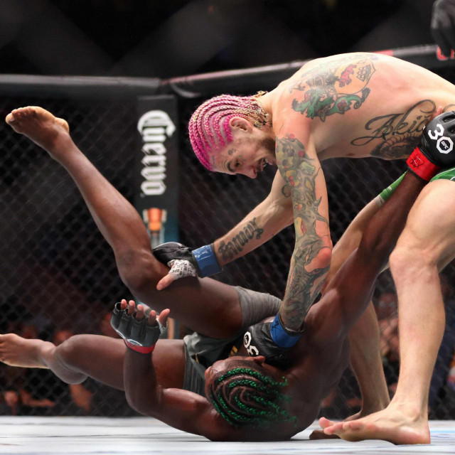 BOSTON, MASSACHUSETTS - AUGUST 19: Sean O�Malley throws a punch against Aljamain Sterling during their Bantamweight title fight at UFC 292 at TD Garden on August 19, 2023 in Boston, Massachusetts. Paul Rutherford/Getty Images/AFP (Photo by Paul Rutherford/GETTY IMAGES NORTH AMERICA/Getty Images via AFP)