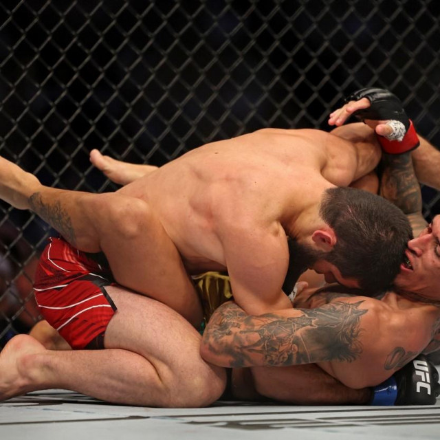 Islam Makhachev (L) competes against Charles Oliveira in the lightweight championship at the Ultimate Fighting Championship (UFC) event at the Etihad Arena in Abu Dhabi on October 22, 2022.,Image: 732551850, License: Rights-managed, Restrictions:, Model Release: no, Credit line: Giuseppe CACACE/AFP/Profimedia