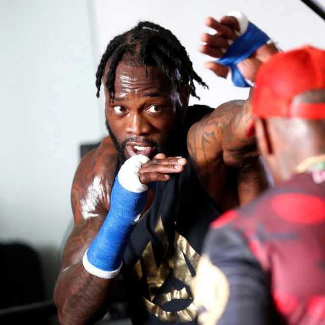 Deontay Wilder (lijevo) i Malik Scott (desno)