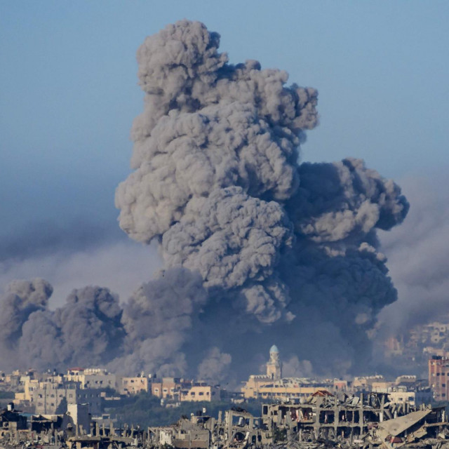 This picture taken from southern Israel near the border with the Gaza Strip shows smoke billowing after an Israeli strike in north Gaza on November 22, 2023, amid ongoing battles between Israel and the Palestinian Hamas movement. (Photo by John MACDOUGALL/AFP)