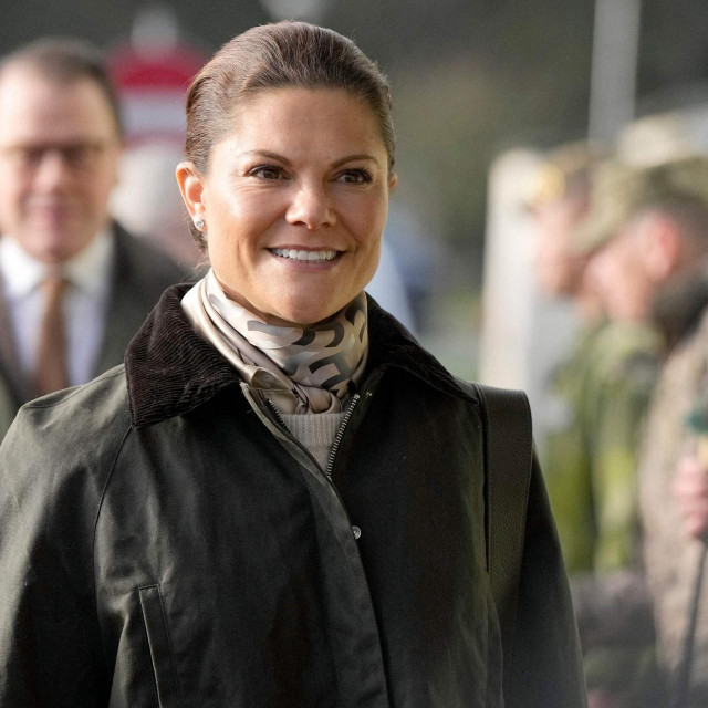 Crown Princess Victoria of Sweden (R) and Crown Prince Daniel of Sweden visit a STANTA training camp in eastern England, on November 29, 2023, where Swedish military personnel are delivering training to Ukrainian soldiers as part of the UK-led Operation Interflex. (Photo by Alastair Grant/POOL/AFP)