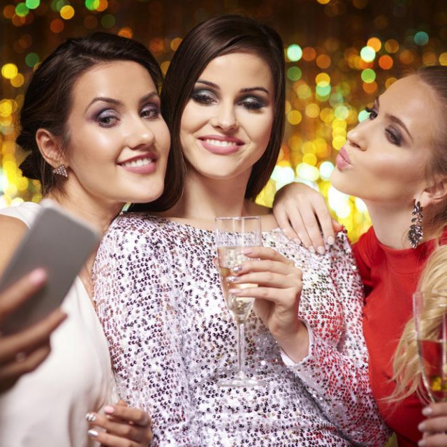 Girls taking selfie at the party