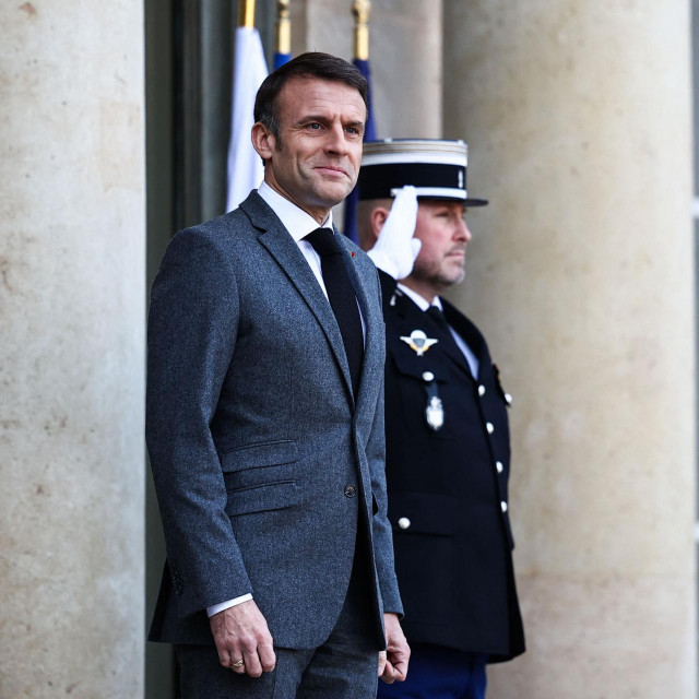 French President Emmanuel Macron waits to welcome Cambodia‘s Prime Minister ahead of a meeting at the Elysee Presidential Palace, in Paris, on January 18, 2024. (Photo by Anne-Christine POUJOULAT/AFP)