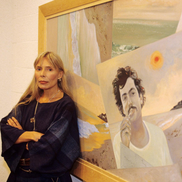 Mandatory Credit: Photo by Peter Brooker/Shutterstock (175932d)
Joni Mitchell and her painting ‘Malibu Fire‘, featuring husband Larry Klein
JONI MITCHELL EXHIBITION OF PAINTINGS ‘DIARY OF A DECADE‘, ROTUNDA GALLERY, LONDON, BRITAIN - 1990