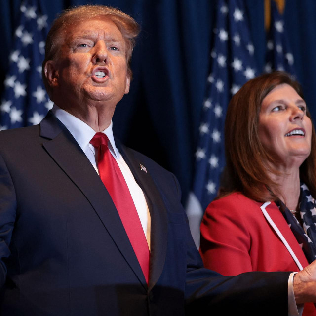 COLUMBIA, SOUTH CAROLINA - FEBRUARY 24: Republican presidential candidate and former President Donald Trump gestures to supporters at an election night watch party at the State Fairgrounds on February 24, 2024 in Columbia, South Carolina. Trump defeated Republican presidential candidate former U.N. Ambassador Nikki Haley in her home state as South Carolina held its primary today. Also pictured is South Carolina Lieutenant Governor Pamela Evette (R). Win McNamee/Getty Images/AFP (Photo by WIN MCNAMEE/GETTY IMAGES NORTH AMERICA/Getty Images via AFP)