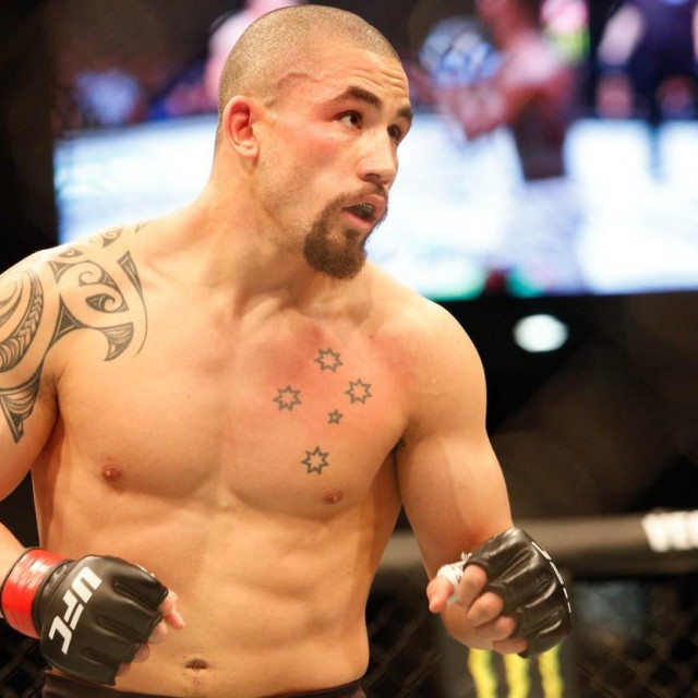 Robert Whittaker of Australia in action against Israel Adesanya of New Zealand during the middleweight title bout of the UFC 243 fight night in Melbourne on October 6, 2019.,Image: 475307379, License: Rights-managed, Restrictions: -- IMAGE RESTRICTED TO EDITORIAL USE - STRICTLY NO COMMERCIAL USE --, Model Release: no, Credit line: ASANKA BRENDON RATNAYAKE/AFP/Profimedia