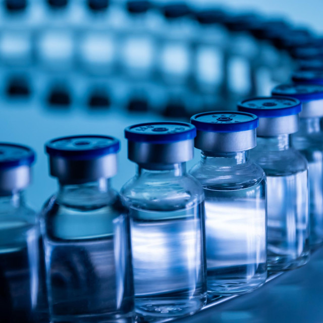 Group of Vaccine bottles. Medicine in ampoules. Glass vials for liquid samples in laboratory.