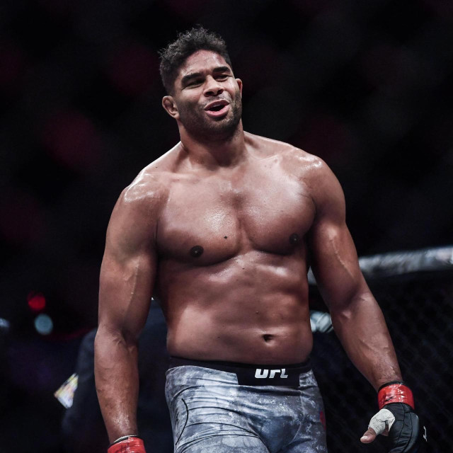 Alistair Overeem of Holland (red gloves) reacts after defeating Sergei Pavlovich of Russia (blue gloves) during the UFC Fight Night at Cadillac Arena in Beijing, China, 24 November 2018. (Photo by Chen bo/Imaginechina/Imaginechina via AFP)