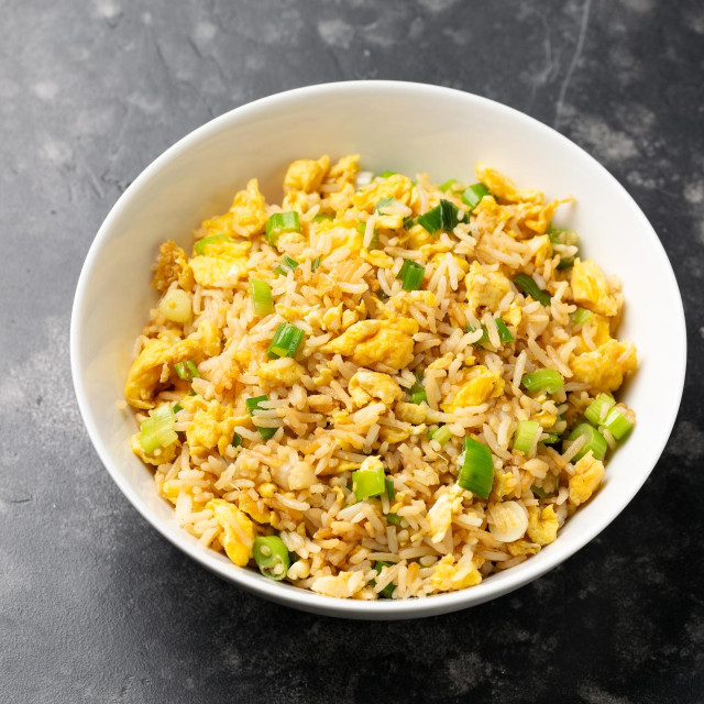 Egg fried rice with garlic, ginger, spring onion and soy sauce. Asian food.