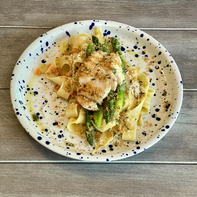 Italian pasta pappardelle with green asparagus and chicken breast