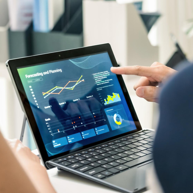close up hand team of financial discussion fintech technology planning, analyzing digital financial data and strategy in a modern office
