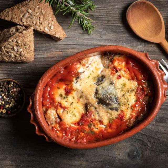 Eggplants meal in layers with tomato sauce and cheese Healthy vegetarian food